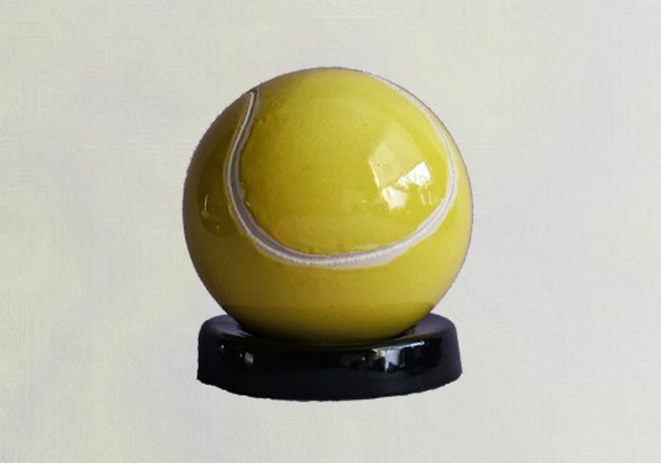 Tennisball on black pedestal